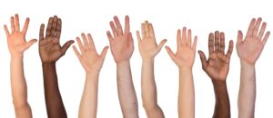 Many hands up isolated on white background asking about the quality statements
