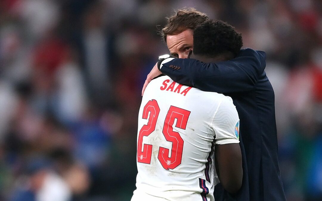 Southgate and Saka hugging