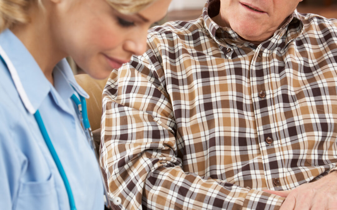 Carer listening to resident and writing